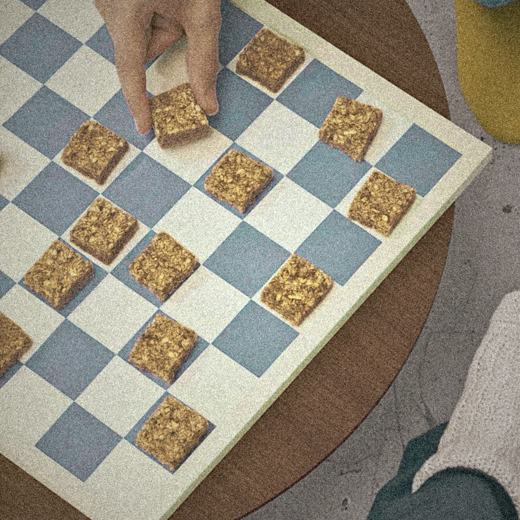 Chess board with oat beta-glucan granola pieces 