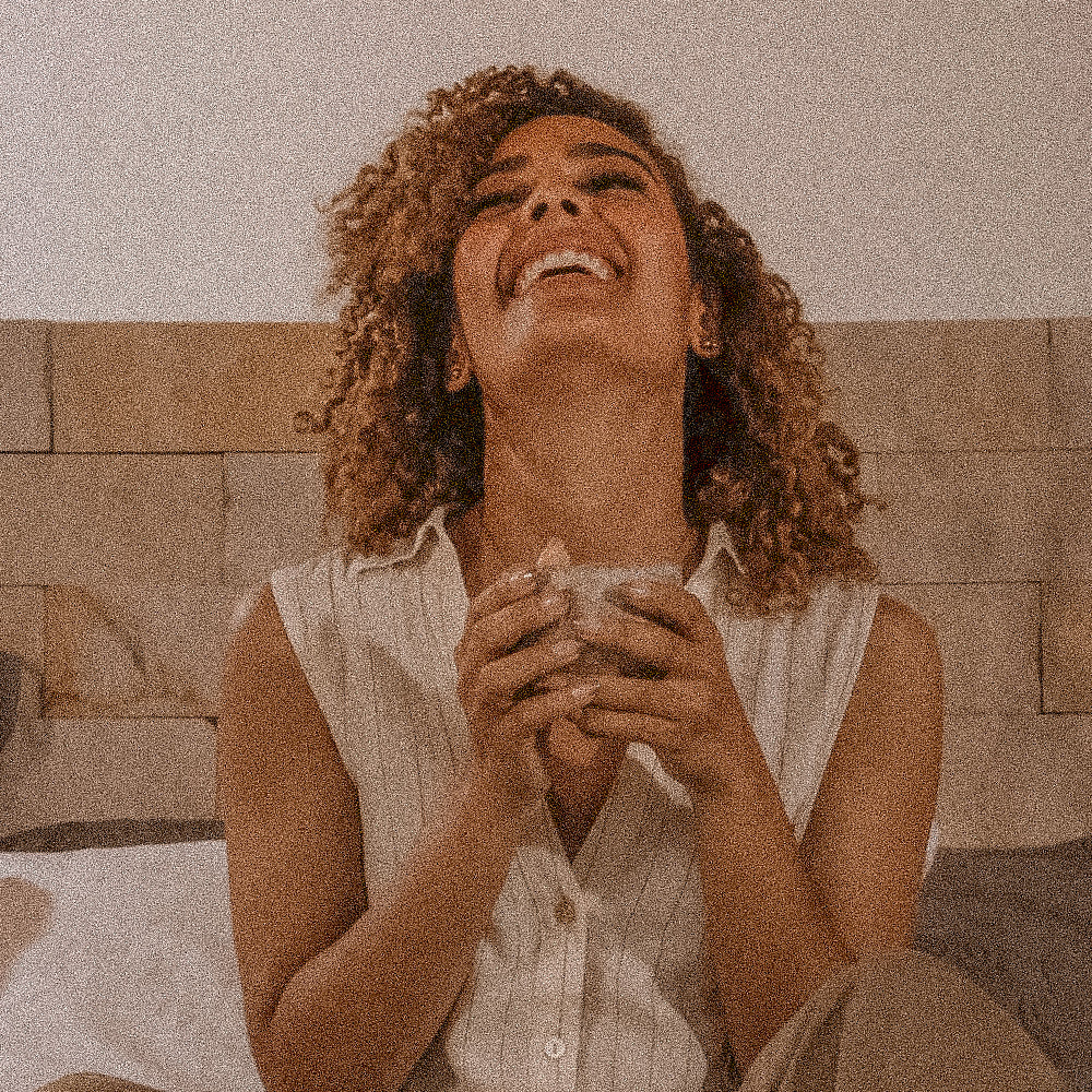 Laughing woman with a mug